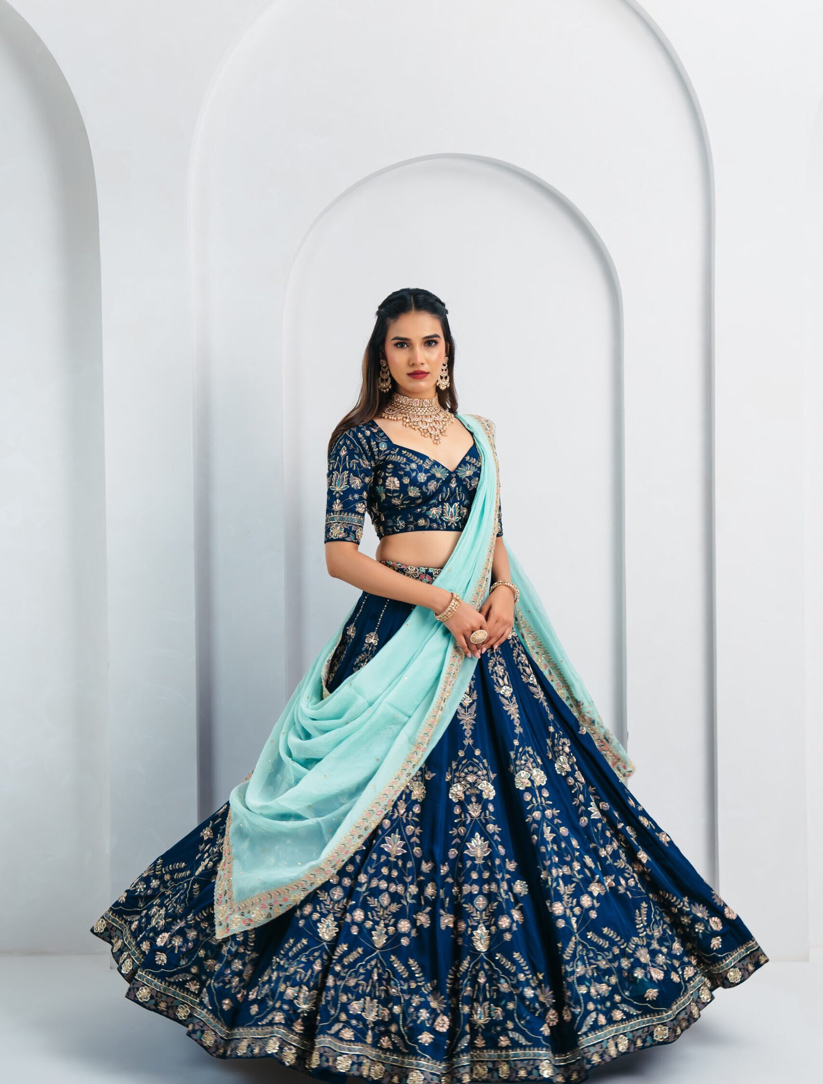 Navy blue bridal lehenga choli with gold zari embroidery and mint green dupatta