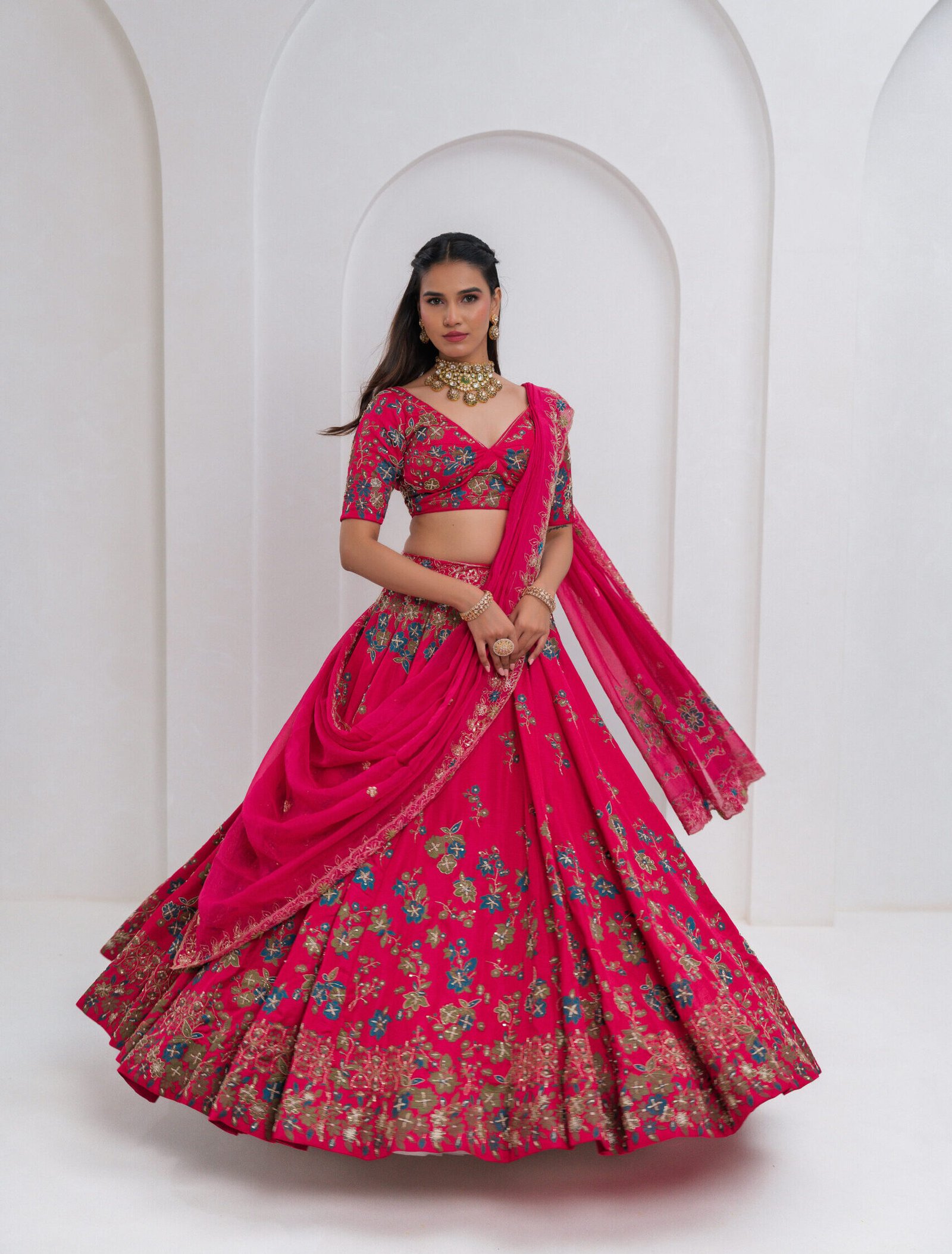 Hot pink bridal lehenga choli with floral zari and resham embroidery,